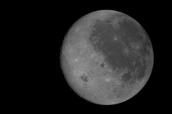 n this fully illuminated view of the Moon, the near side (the hemisphere we see from Earth), is visible on the right, identifiable by the dark splotches that cover its surface, as viewed by the crew of the NASA Artemis II inside the Orion spacecraft.