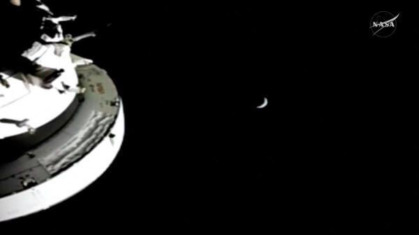 A view of the Earth from the Artemis II mission's Orion capsule after the spacecraft had reached its farthest distance from the planet when it traveled around the Moon, in this screengrab taken from a livestream video.