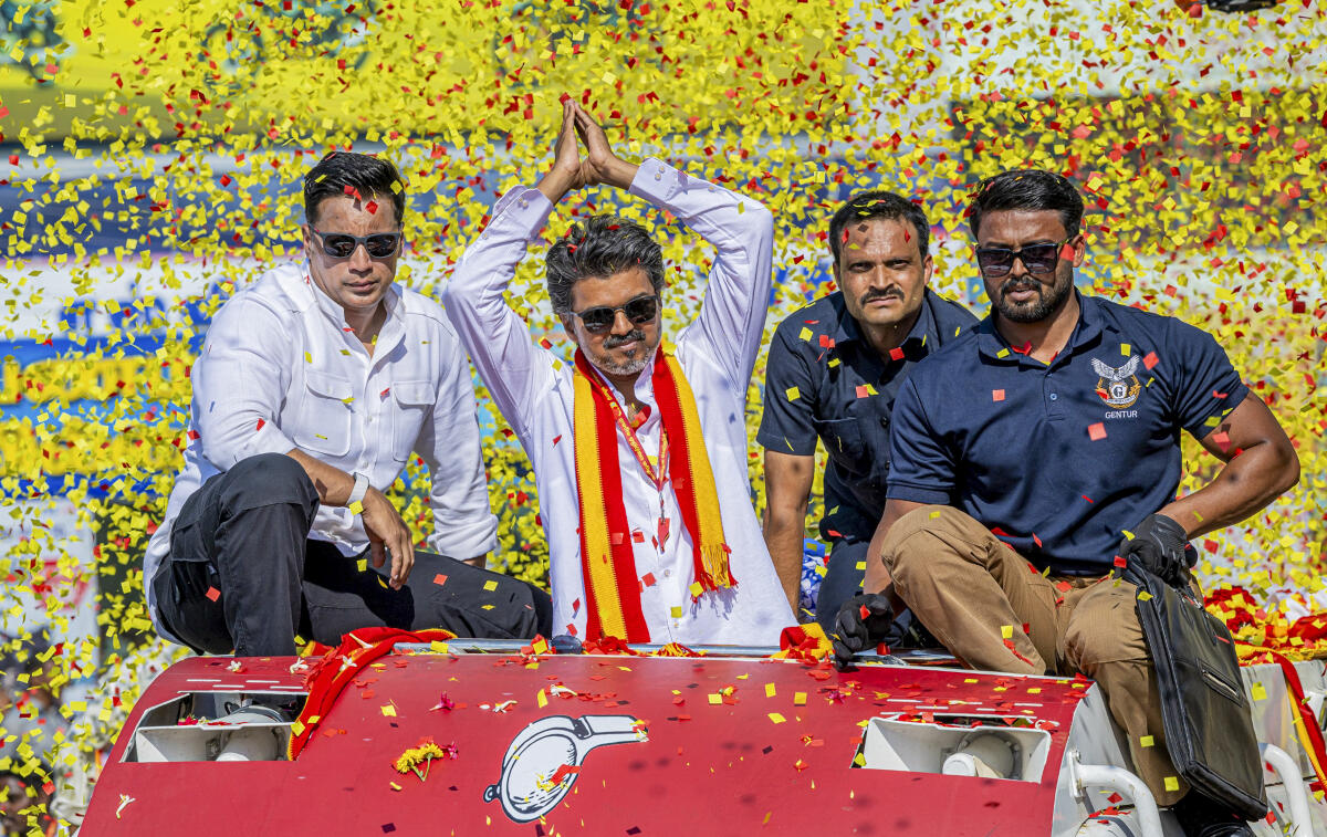 Tamilaga Vettri Kazhagam (TVK) chief and candidate from the Tiruchirappalli East constituency, Vijay, during a roadshow ahead of the Tamil Nadu Assembly elections, in Tiruppur. PTI