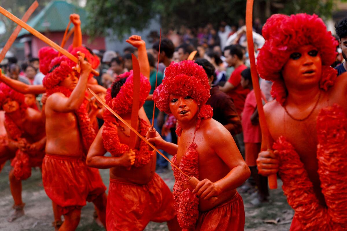 Hindu devotees celebrate the Lal Kach festival to mark the end of Bengali new year, in Munshiganj, Bangladesh. Reuters 