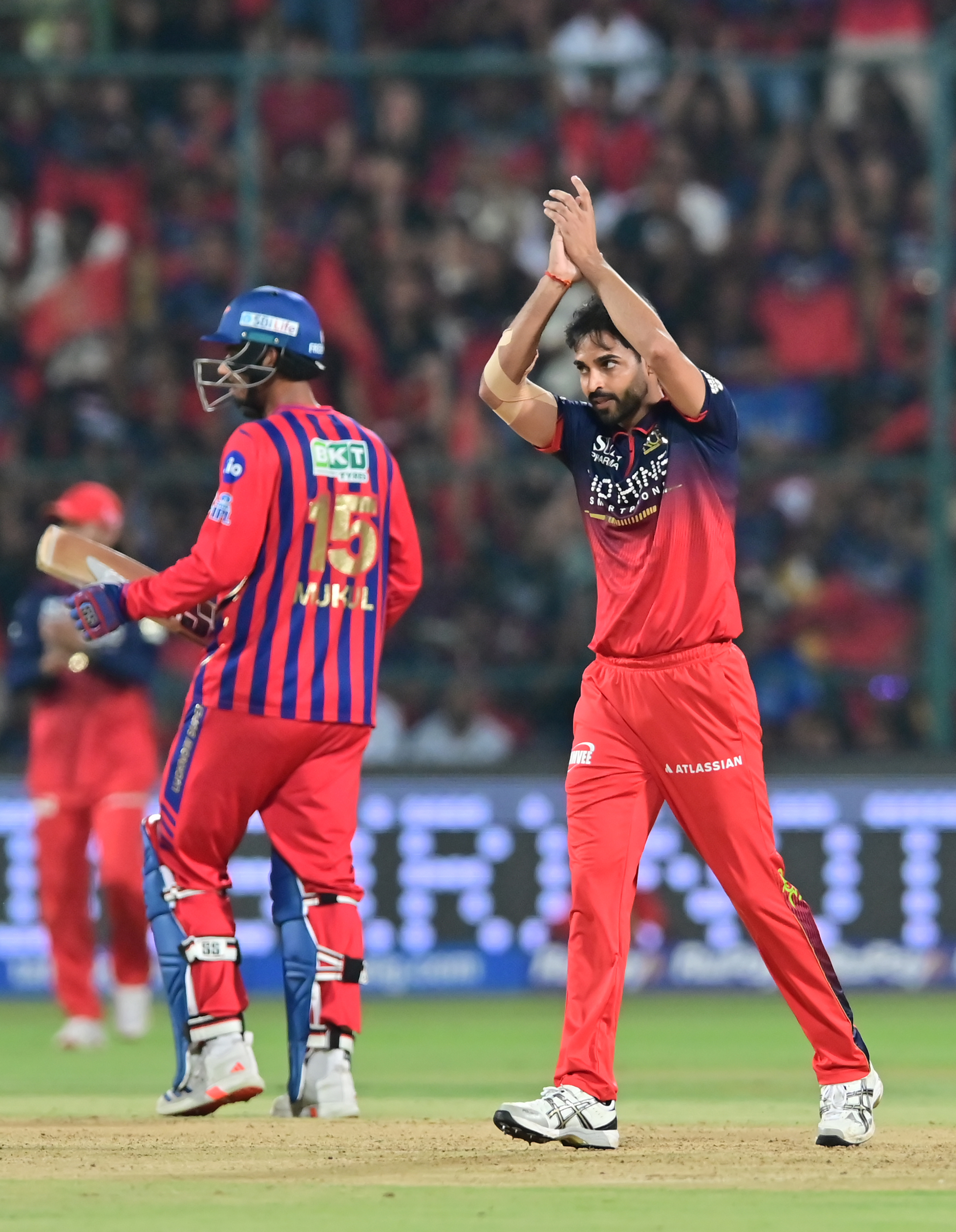 RCB pace troika choked LSG batting as Rasikh Dar (left) took a four-for while Josh Hazelwood was adjudged Player of the Match for a 1/20. Bhuvneshwar Kumar (below) was as impressive with figures of 3/27. DH Photos/ Prashanth HG