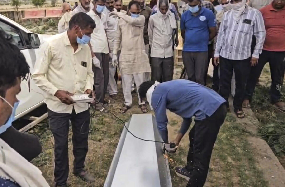Family members and locals gather as the body of Anshu, who died in the Russia-Ukraine war, is brought to his native village Kathuwas, in Rewari district, Friday, April 17, 2026. Anshu had gone to Russia in April 2025 on a study visa and was allegedly duped by agents before being forcibly enlisted in the Russian Army. PTI