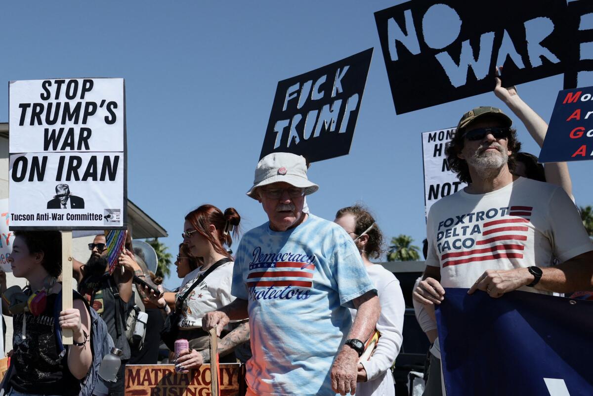 Demonstrators protest outside the venue of a Turning Point USA event, in Phoenix. Reuters 