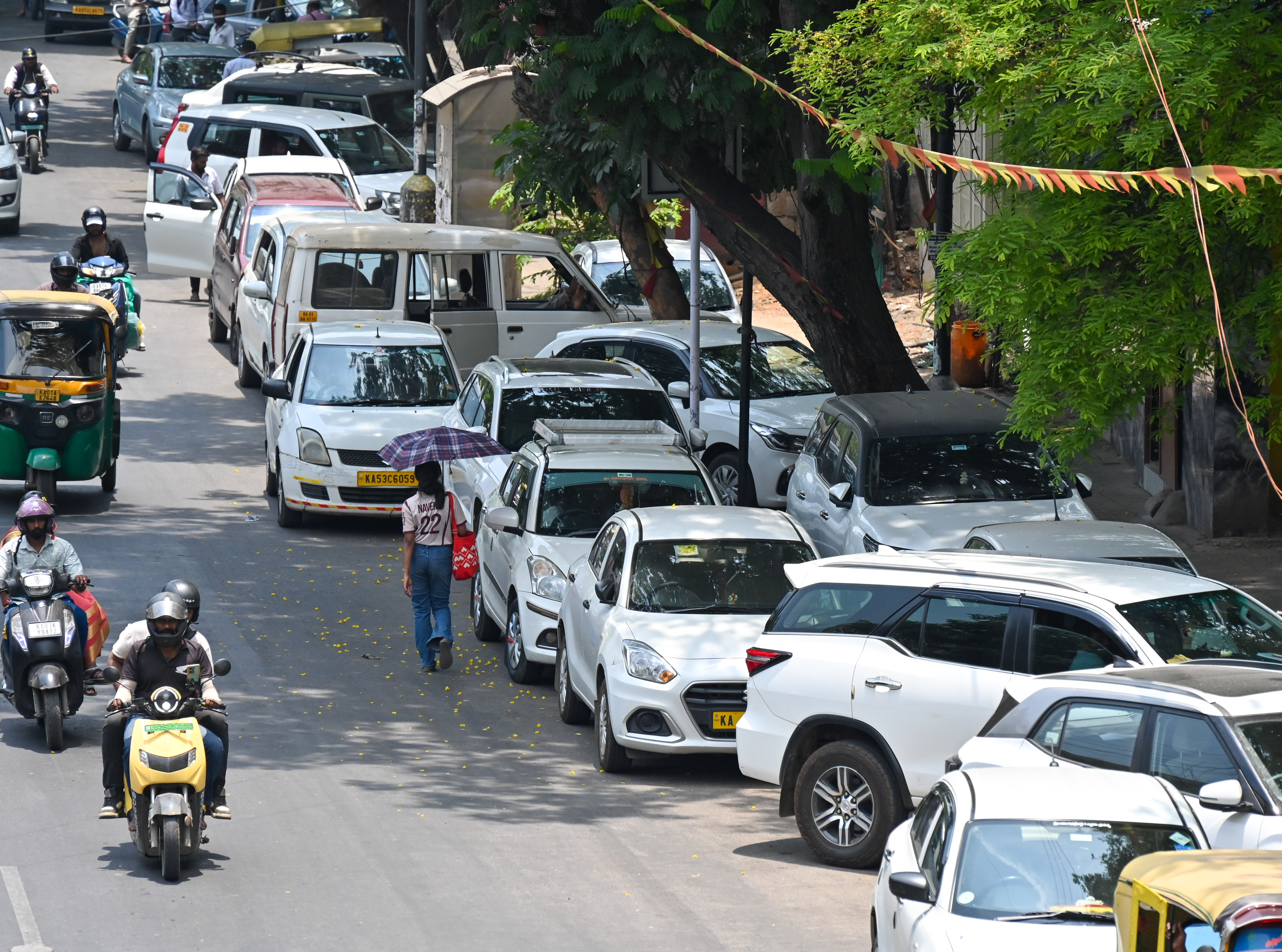 Parked vehicles on the busy Residency Road Bengaluru. 