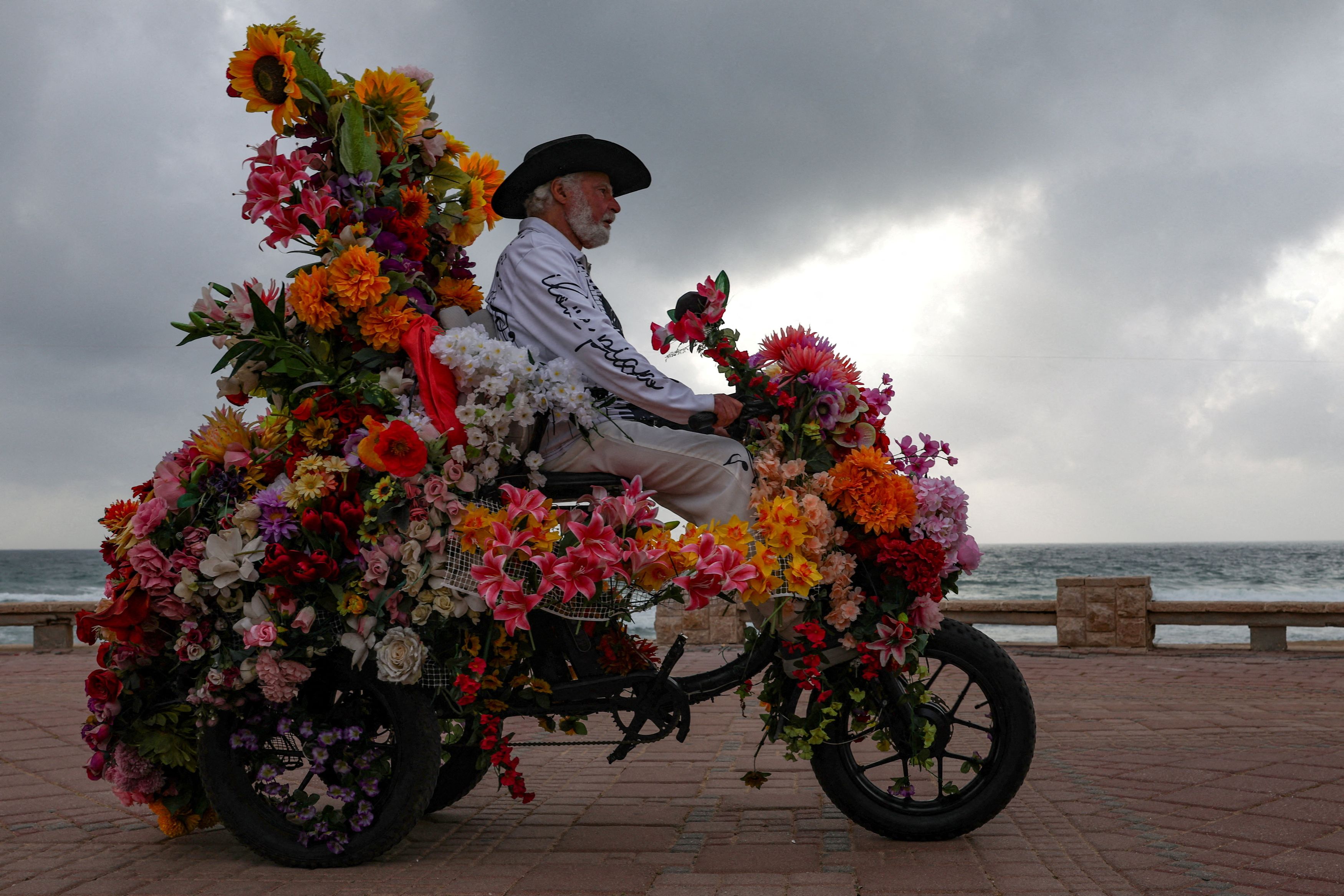 A man rides an electric tricycle after a 10-day ceasefire between Lebanon and Israel went into effect, in Nahariya, northern Israel. Reuters