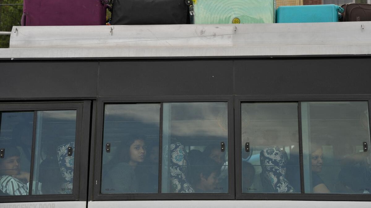 Tourists sit in tempo as they head towards the airport, following a suspected militant attack near south Kashmir's Pahalgam, in Srinagar April 23, 2025.