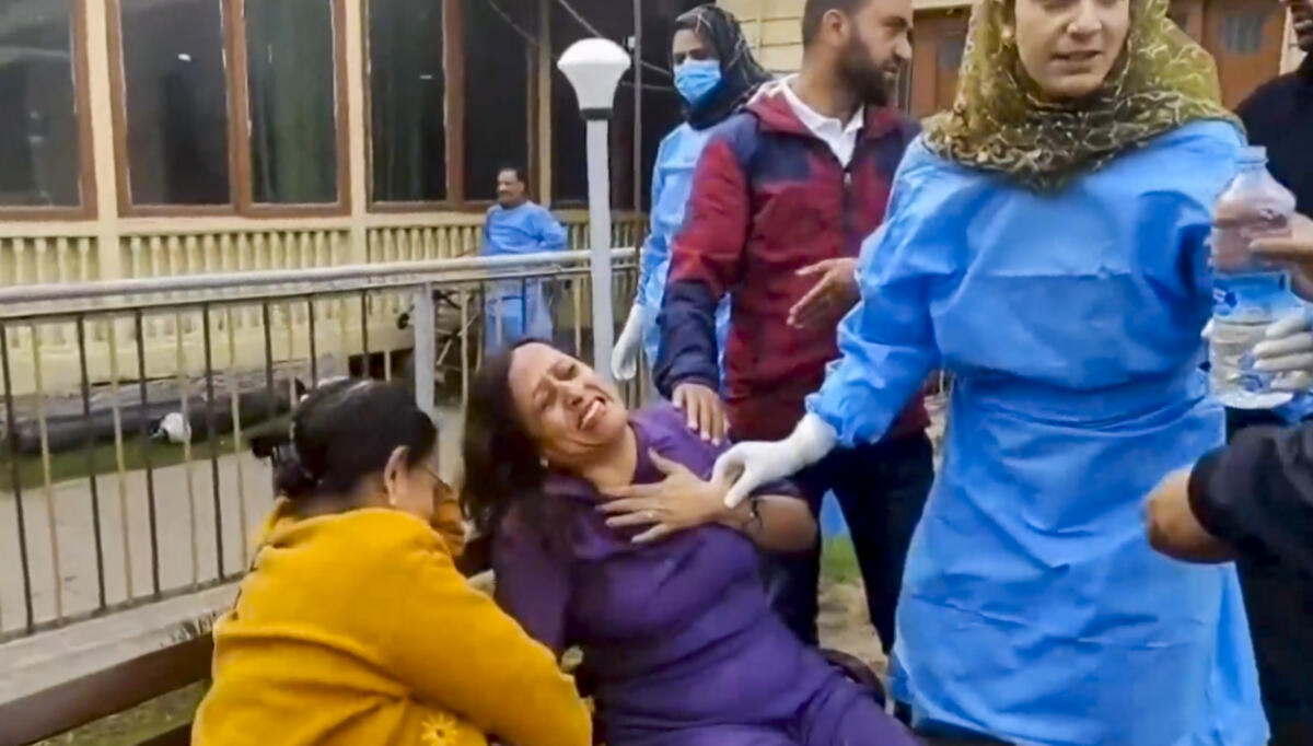 People react after terrorists attacked a group of tourists at Pahalgam, in Anantnag district, Jammu &amp; Kashmir, Tuesday, April 22, 2025. 