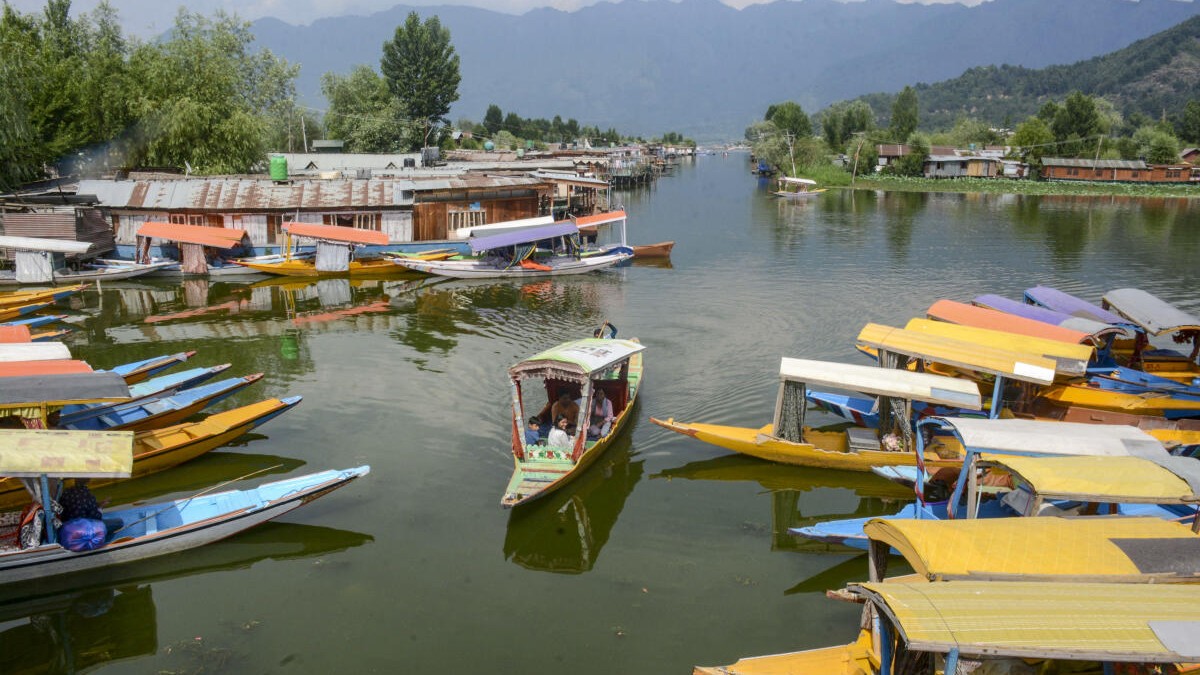 Tourists take a shikara ride in the Dal Lake, amid a decrease in number of tourists following the Pahalgam terror attack, in Srinagar