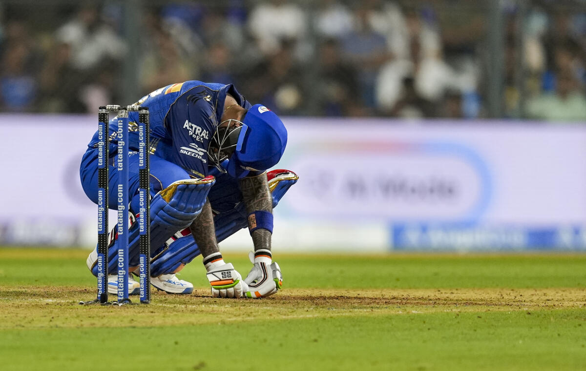 Mumbai Indians' Suryakumar Yadav reacts in pain during the Indian Premier League (IPL) 2026 T20 cricket match between Mumbai Indians and Chennai Super Kings, in Mumbai, Maharashtra.