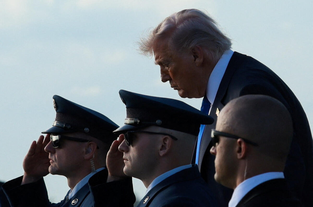 US President Donald Trump disembarks Air Force One at Palm Beach International Airport in West Palm Beach, Florida.