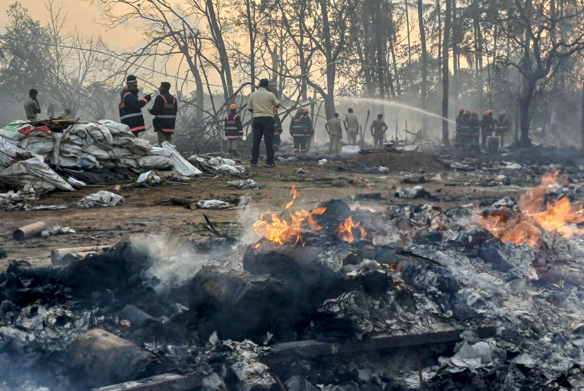 Firefighters douse a blaze after a fire broke out at a fireworks manufacturing unit at Mundathikode village, in Thrissur district. PTI