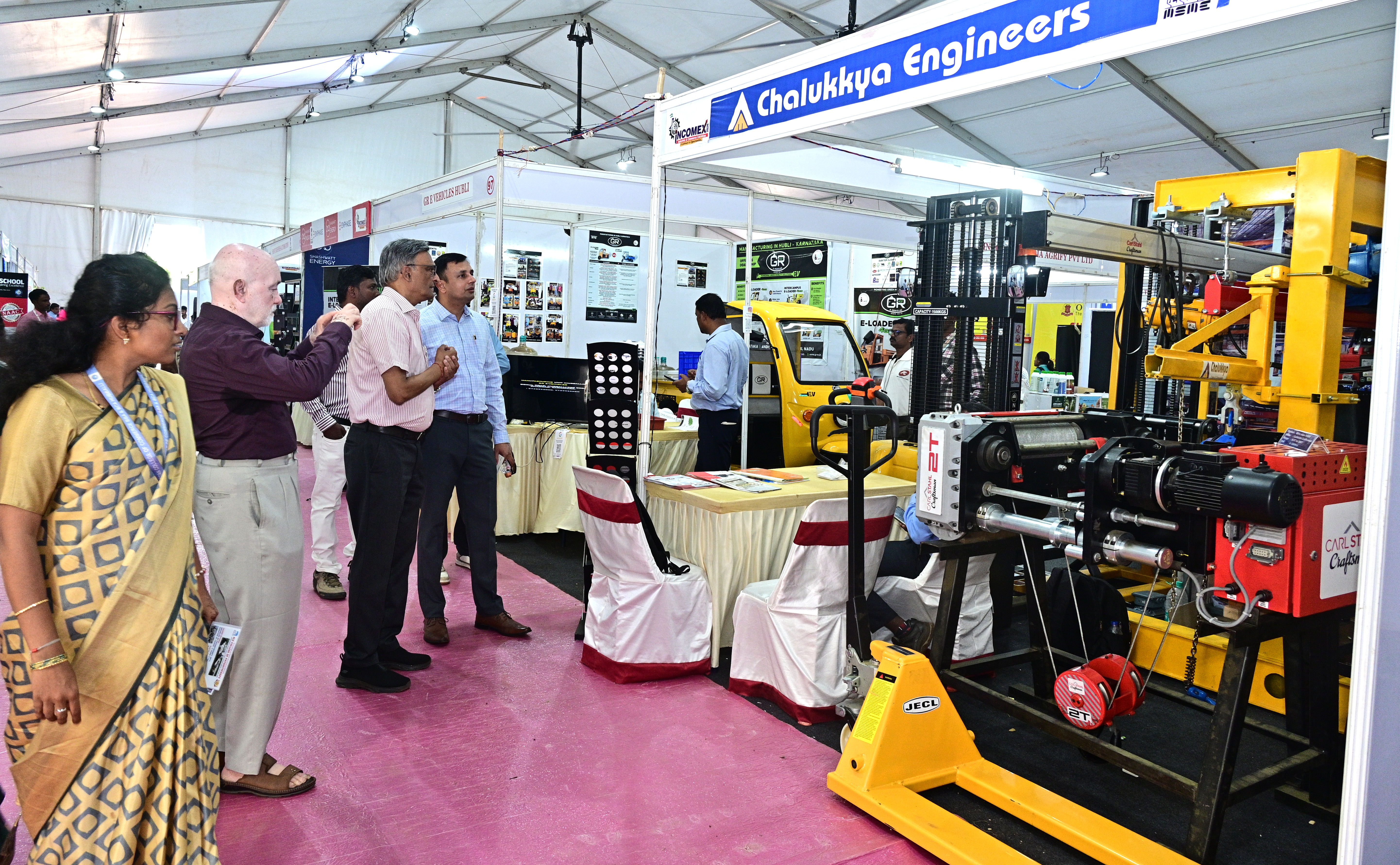 Visitors look at equipment on display at 'Incomex-2026' industry and trade exhibition being held in Hubballi.