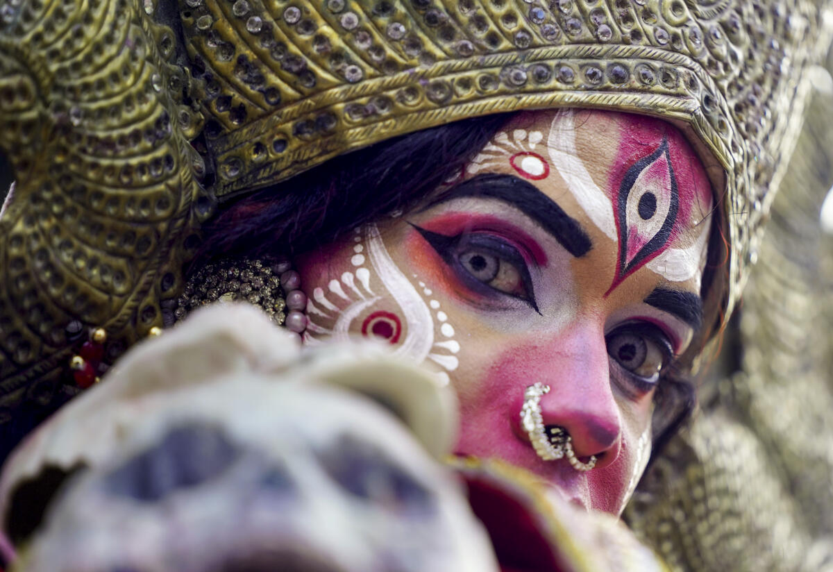 An artist dressed as Goddess Kali during a religious procession, in Ajmer, Monday, April 27, 2026. 