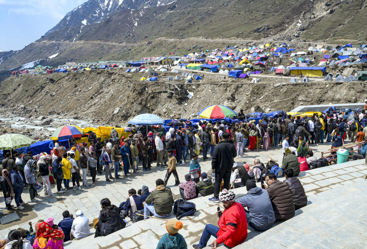 People queue up for darshan at Kedarnath temple during the Char Dham Yatra, in Rudraprayag district, Tuesday, April 28, 2026.