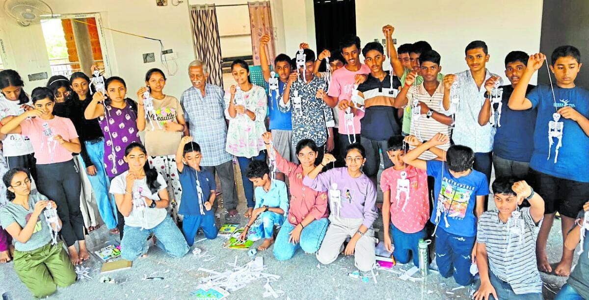Children display the skeletons prepared by them at a summer camp on science organised by the Sagara Science Forum at the Science Centre in Sagara.