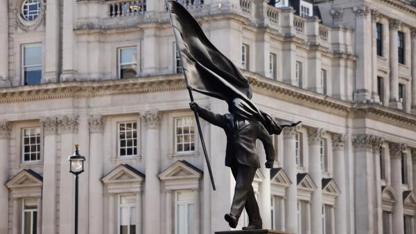 Banksy installs statue of flag-wielding man in central London