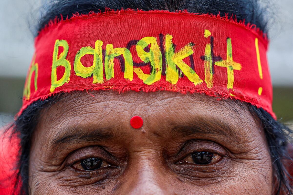 A close-up shows a protester wearing a headband reading "Bangkit" (Rise), during a May Day rally celebrating workers’ rights and labor solidarity, in Kuala Lumpur, Malaysia, May 1, 2026.