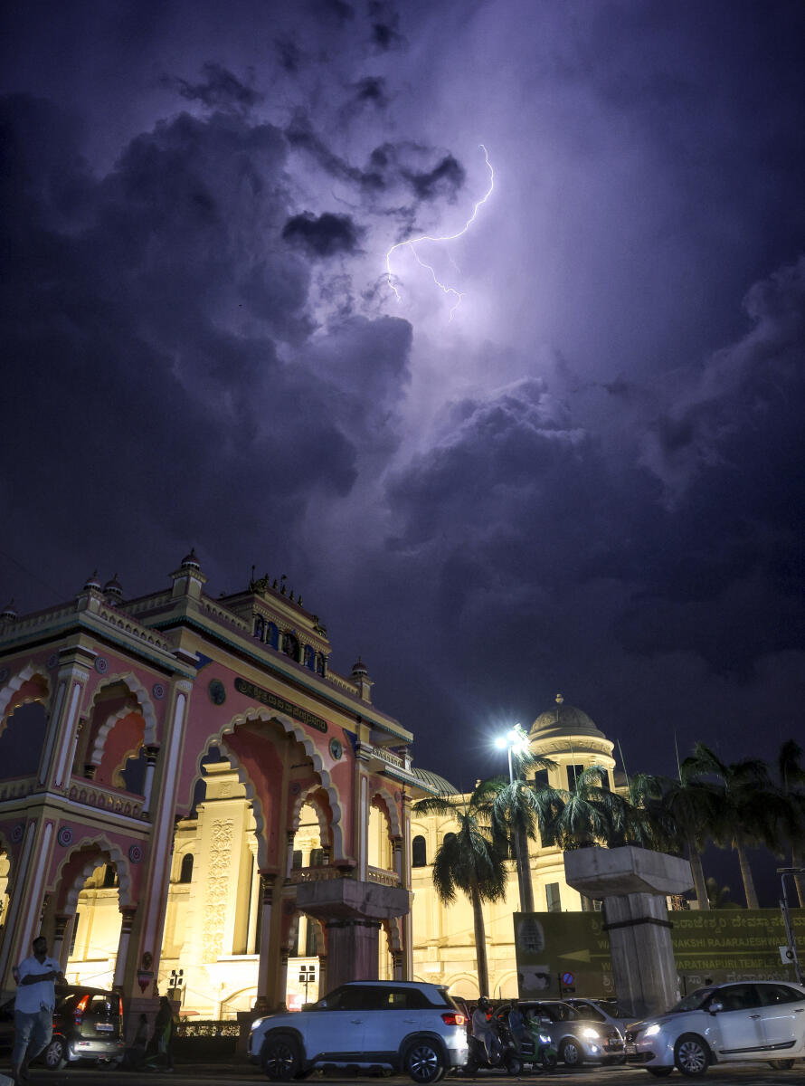 Lightning occurs amidst dark clouds as seen over the Rajarajeshwari Nagar Mahadwara, in Bengaluru, Friday, May 1, 2026.