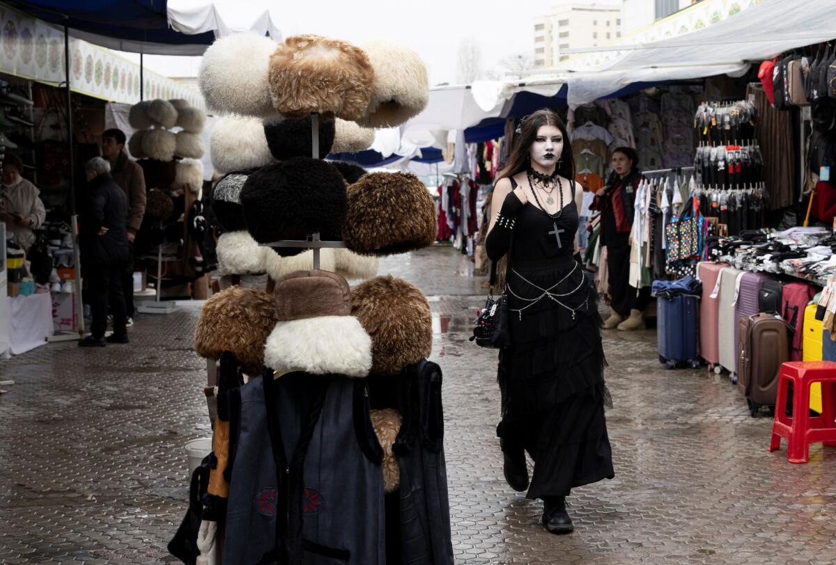 People walk through an open bazaar in Ashgabat, Turkmenistan