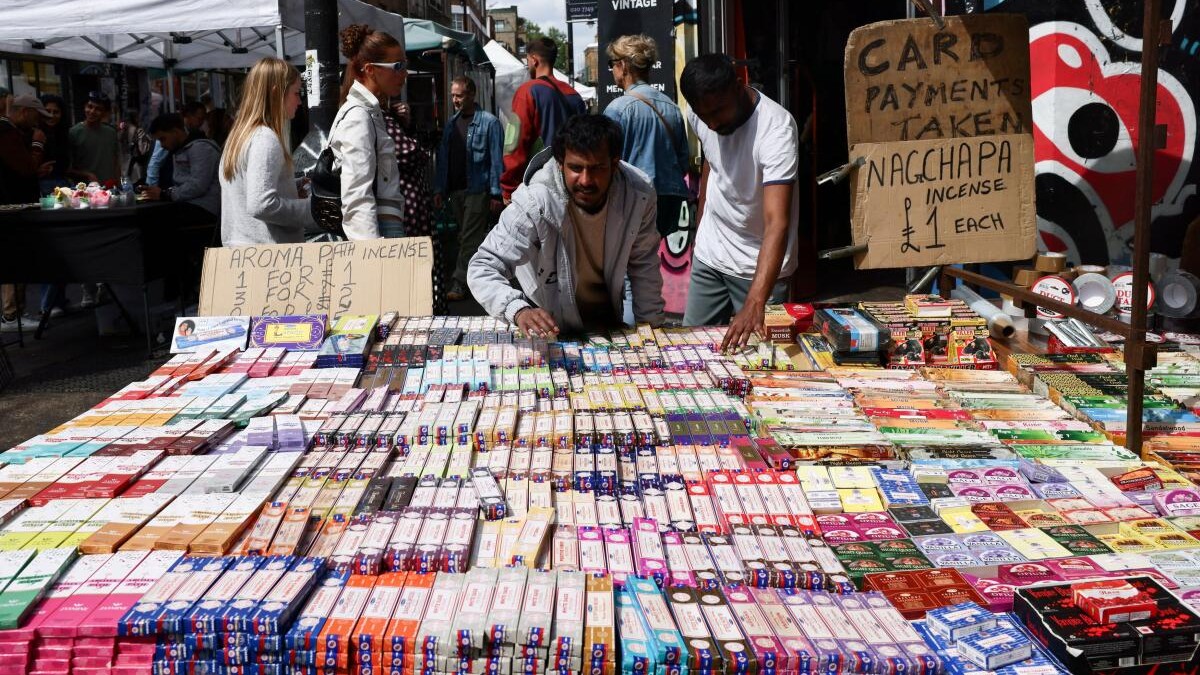 A man reaches for a box of incense at a market stall in Tower Hamlets, London, Britain, May 3, 2026.