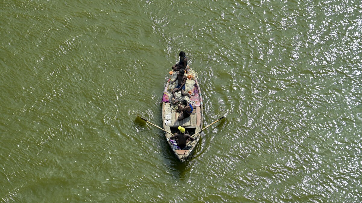 Fishermen row their boat in Ganga river on a hot summer day, in Prayagraj, Uttar Pradesh, Sunday, May 3, 2026.