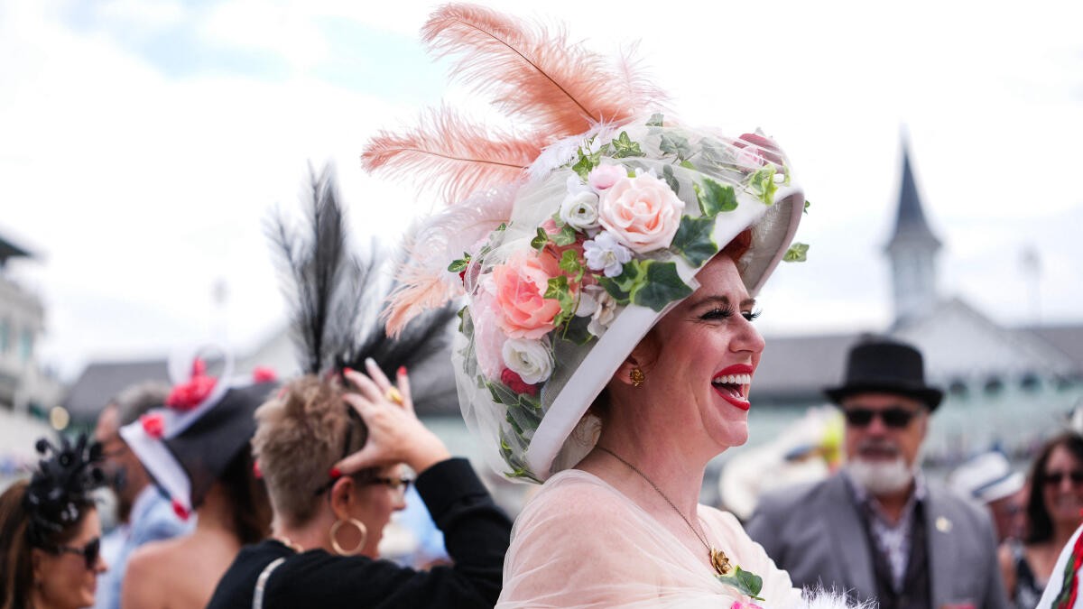 Louisville, KY, USA; Carrie Ketterman shows off her derby hat during the 152nd running of the Kentucky Derby at Churchill Downs.