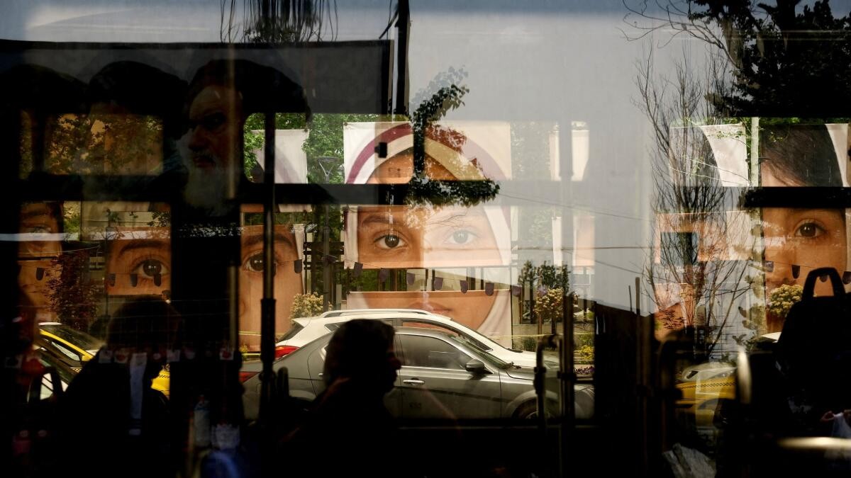Images depicting the Minab school students who were killed in a strike are displayed in Tajrish Square in Tehran, Iran, May 4, 2026.