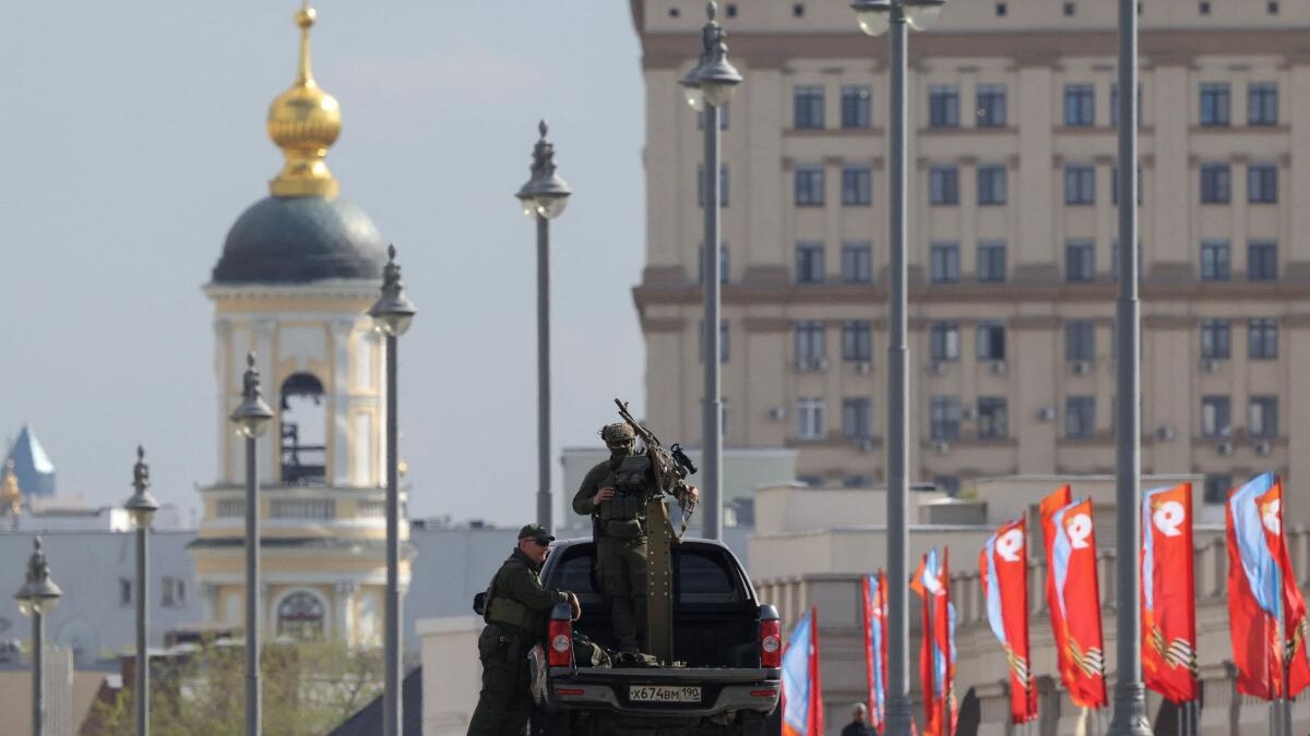 Security personnel armed with machine gun patrol in central Moscow, Russia, May 4, 2026.