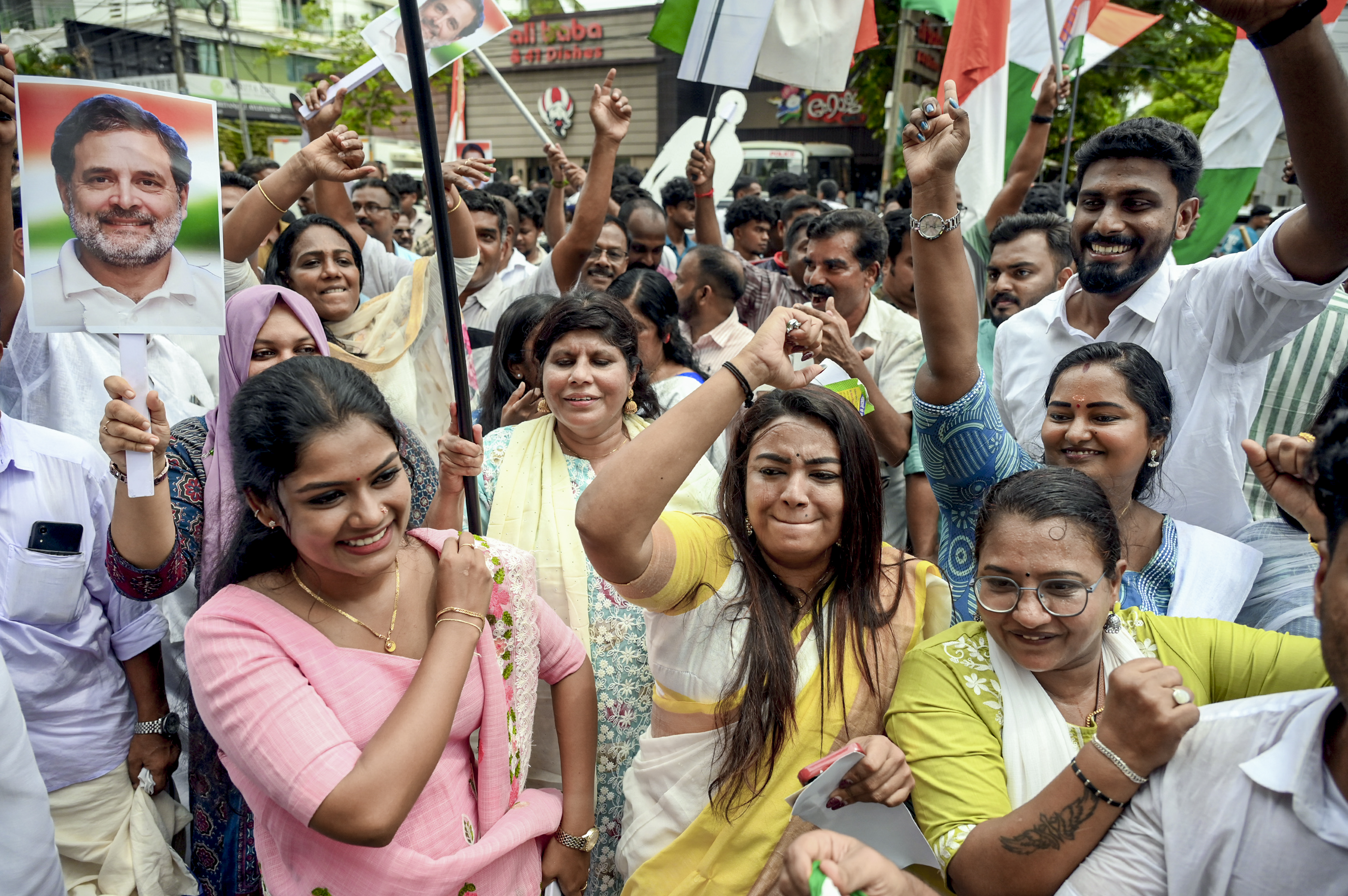 Congress workers take out a victory march in Kerala on Monday. PTI