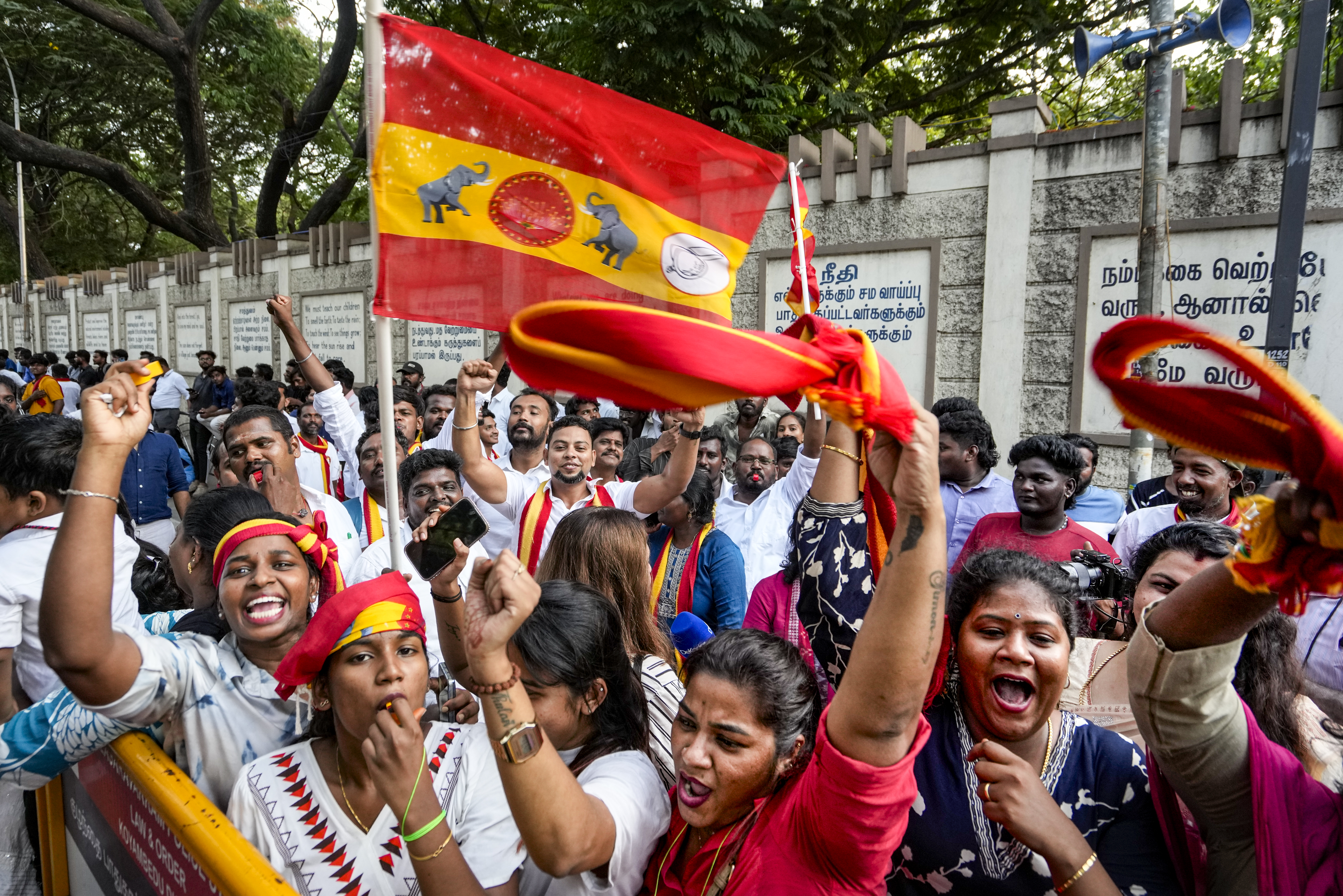 TVK supporters cheer as the party chief Vijay wins the Tamil Nadu elections on Monday. PTI 