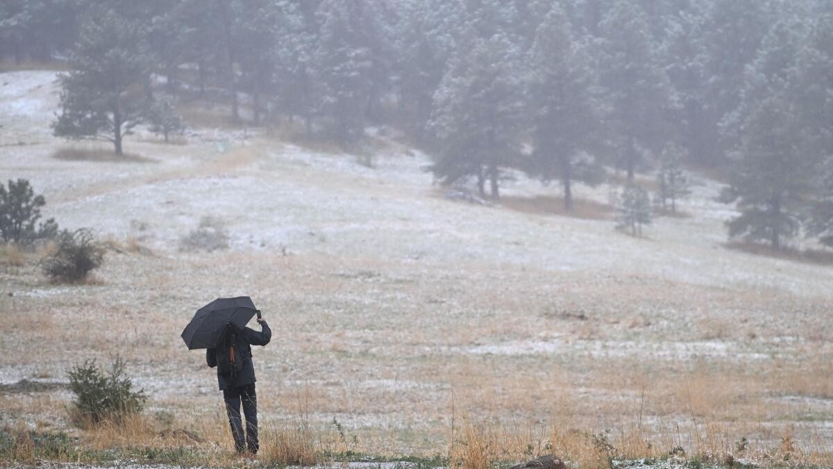 A man photographs snow in Chautauqua Park amid the worst drought in Colorado’s history in Boulder, Colorado, US May 5, 2026.