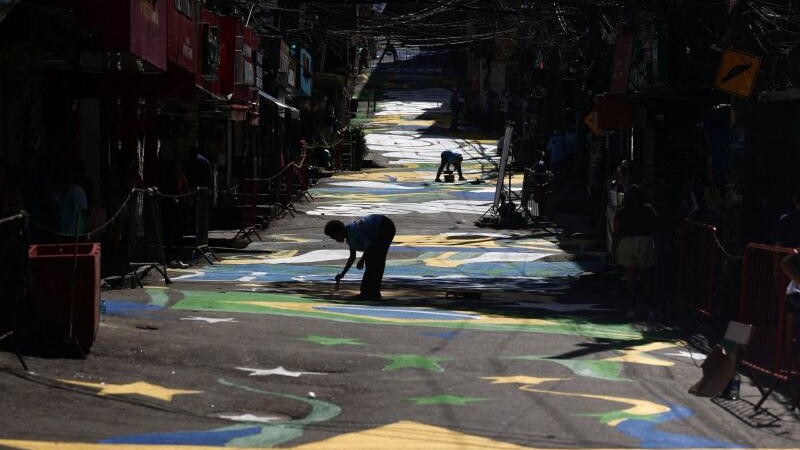 People paint World Cup-themed graffiti on a street in Rocinha favela, ahead of the 2026 FIFA World Cup, in Rio de Janeiro, Brazil May 5, 2026.