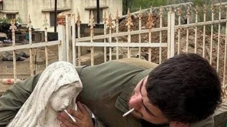 IDF soldier places cigarette in mouth of Virgin Mary statue in Lebanon