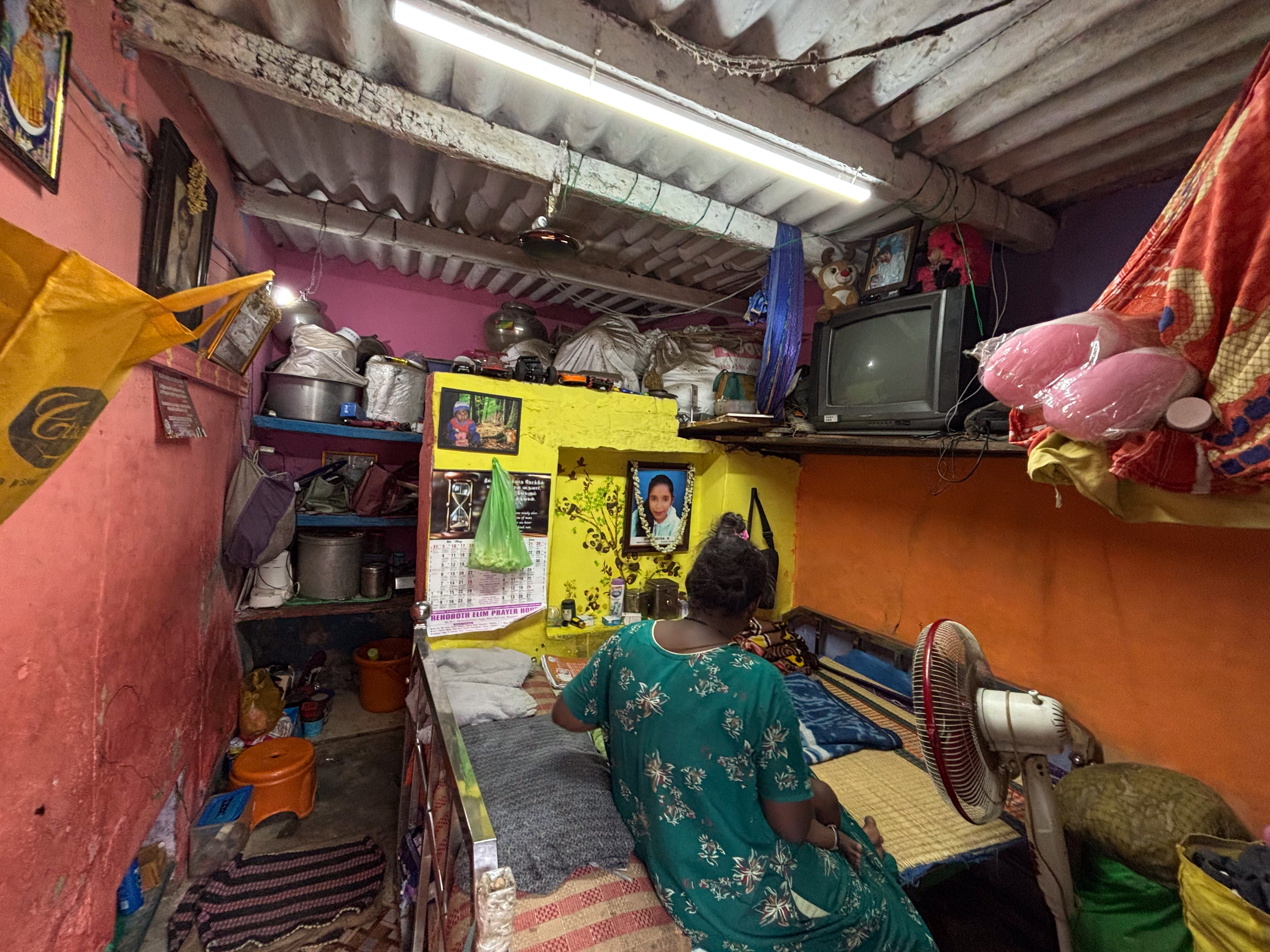 Houses with asbestos and corrugated tin roofs record daytime temperatures about 6°C higher and night-time temperatures 2 to 3°C higher than the ambient temperatures. In pic a family living in a house with asbestos-cement roofs in Bengaluru. DH PHOTO/PUSHKAR V