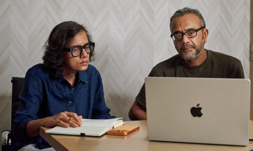 Mentor Dibakar Banerjee (right) reviews footage of Kathar Katha (The Tale of Katha) with Dhritisree Sarkar on MacBook Pro.