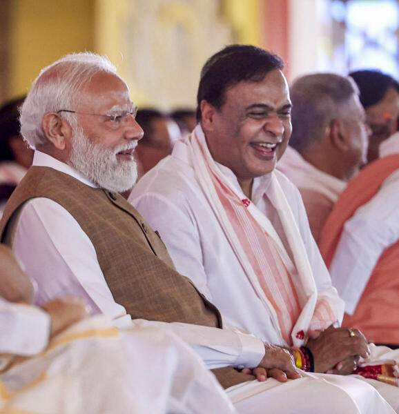 Prime Minister Narendra Modi with newly sworn-in Assam Chief Minister Himanta Biswa Sarma during the swearing-in ceremony of the state government, at Khanapara in Guwahati.