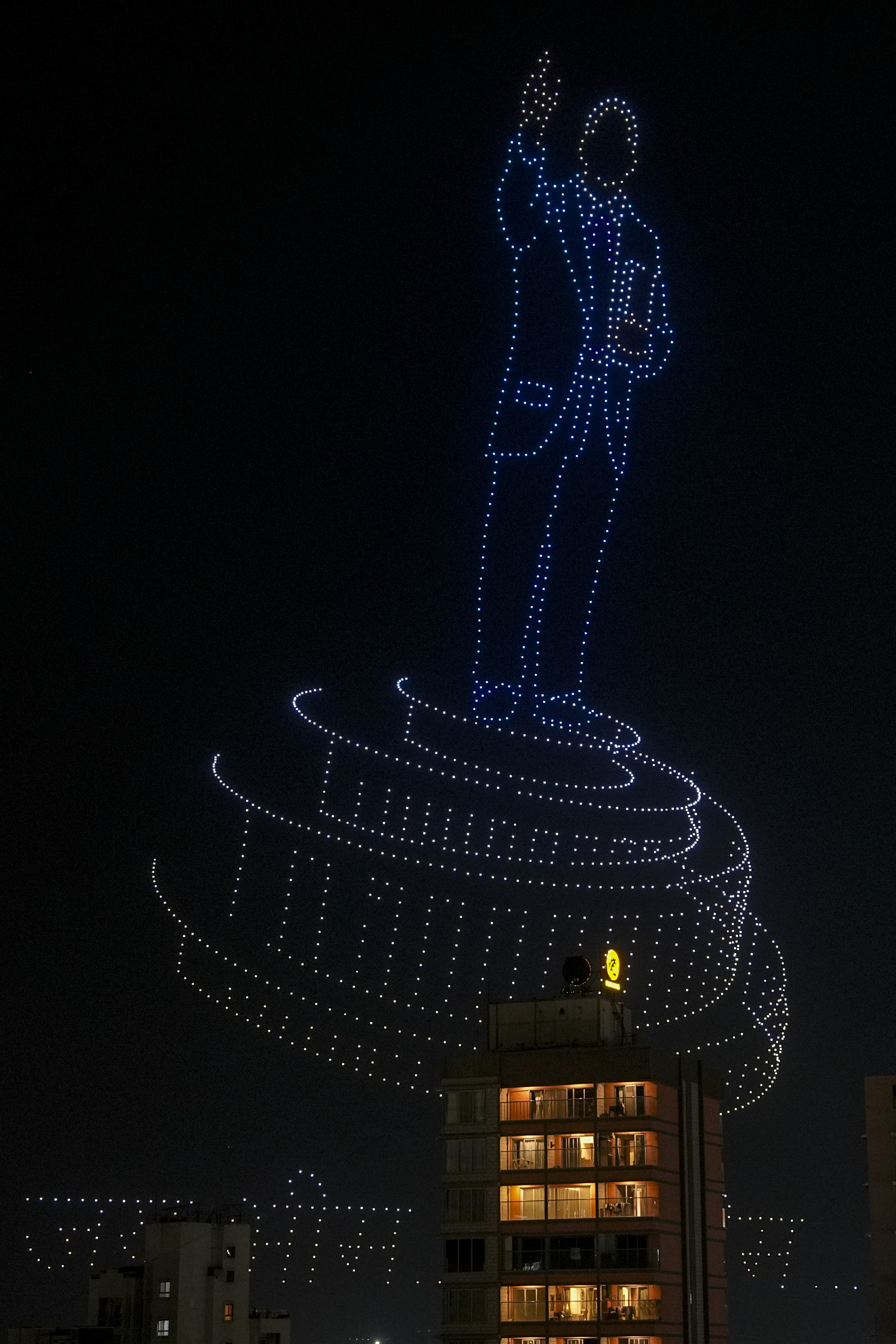 An illuminated view from a drone show marking the 135th birth anniversary of Babasaheb Ambedkar, at Chhatrapati Shivaji Maharaj Park in Dadar