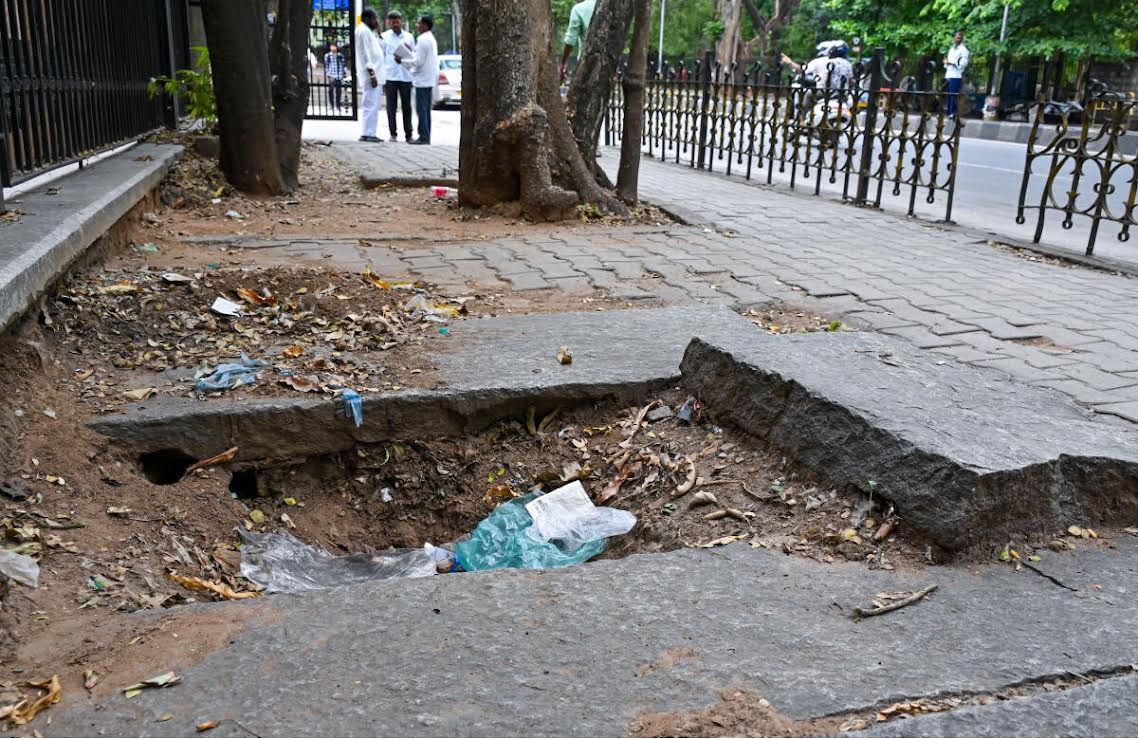 An uneven footpath near Vidhana Soudha, Dr Ambedkar Road.  