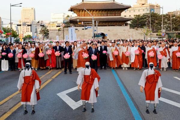Participants including Buddist monks holding Lotus Lanterns, and Android robot monks take part in a Lotus Lantern parade ahead of Buddha’s birthday in Seoul, South Korea.