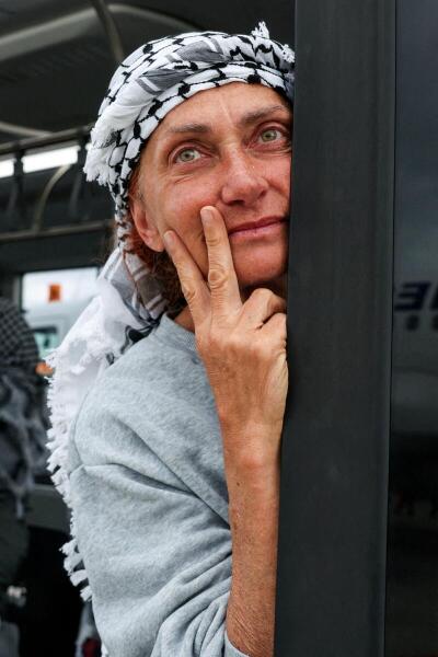 Italian activist from the Gaza-bound Global Sumud Flotilla, Ilaria Del Mastro, a nurse at San Giovanni Addolorata Hospital, gestures upon arrival at Istanbul Airport in Istanbul, following her detention by Israeli forces after the vessels were intercepted in international waters in the Mediterranean Sea
