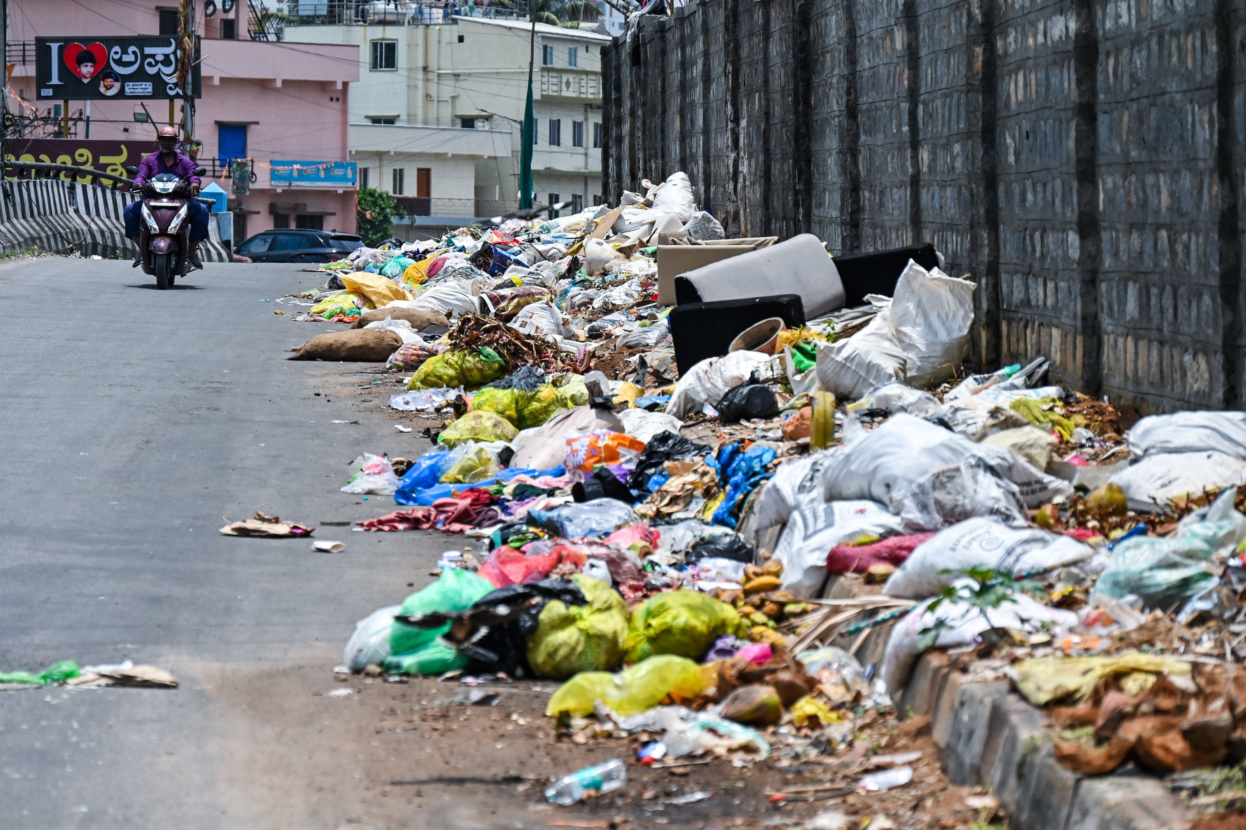 Heaps of uncleared garbage off Outer Ring Road at Kadirenahalli in Banashankari. 