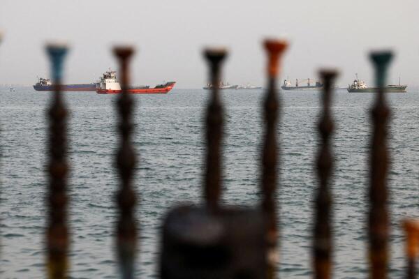 Vessels in the Strait of Hormuz are visible near the beach of Bandar Abbas, Iran.