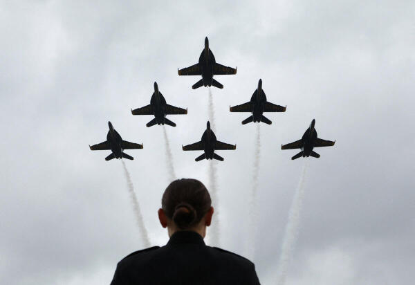 The Blue Angels perform a flyover at the start of the Graduation and Commissioning Ceremony at the US Naval Academy in Annapolis, Maryland, US