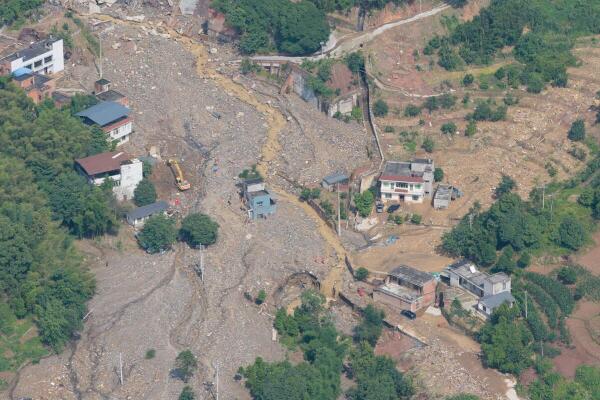 A drone view of rescue operations underway in Anxi village following flash floods and landslides triggered by extreme rainfall, in Yongchuan district, Chongqing, China.