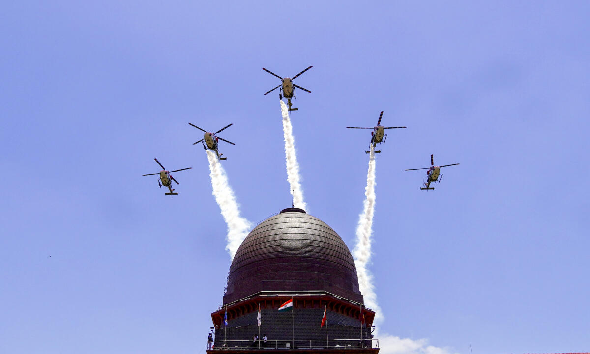 Indian Air Force's (IAF) Sarang display team performs manoeuvres during the convocation ceremony of the 150th course of National Defence Academy (NDA) at Khadakwasla, in Pune district, Maharashtra.