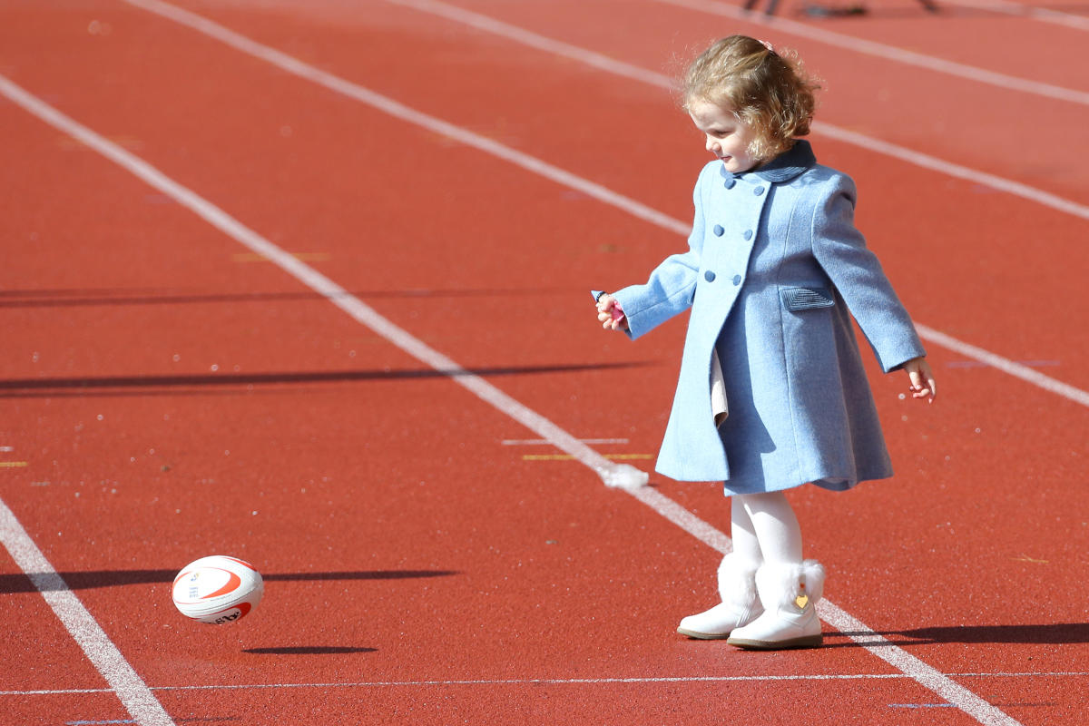 Princess Gabriella of Monaco plays with a ball during the International Rugby Tournament.