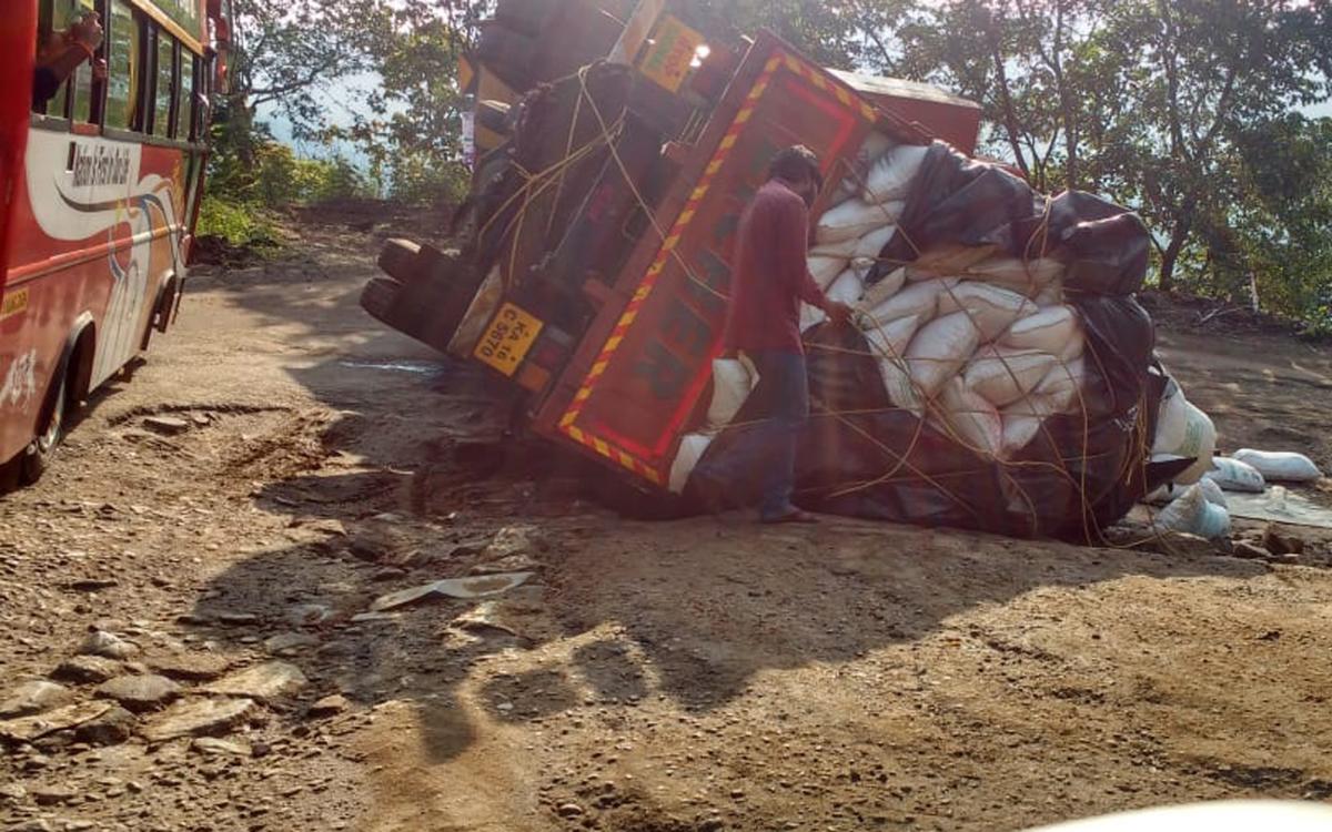Lorry topples on Charmadi Ghat