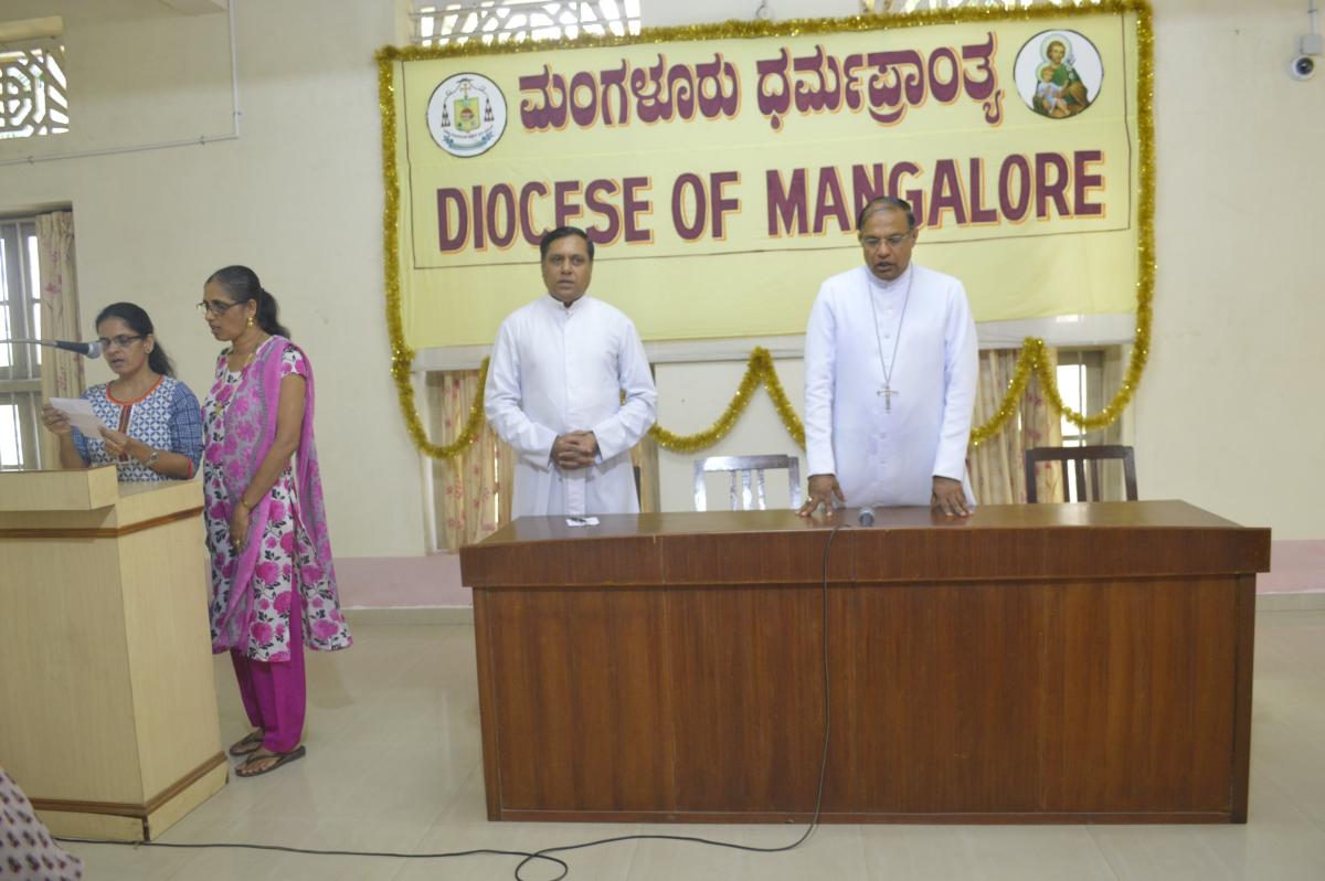 Bishop gives scholarships to poor students