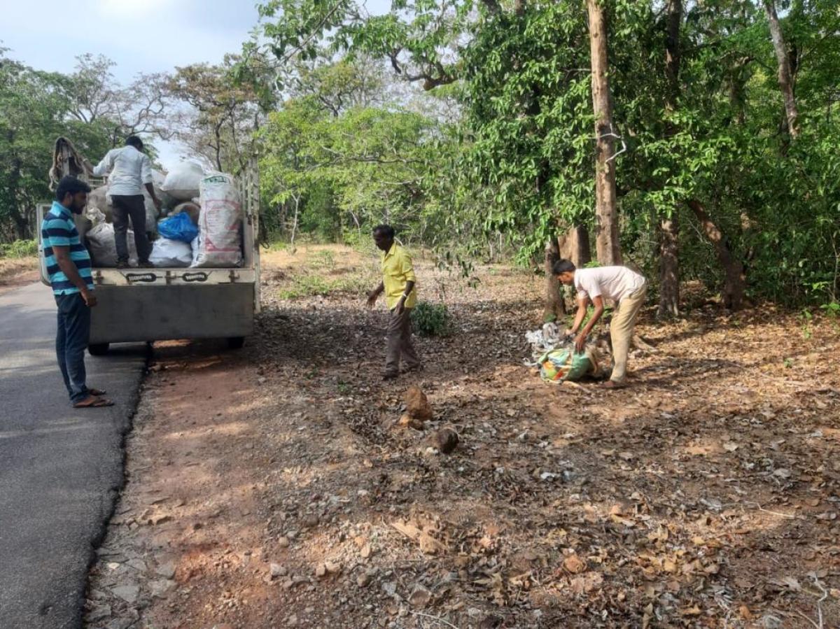 Karnataka: Forest department officials clear liquor bottles, plastic