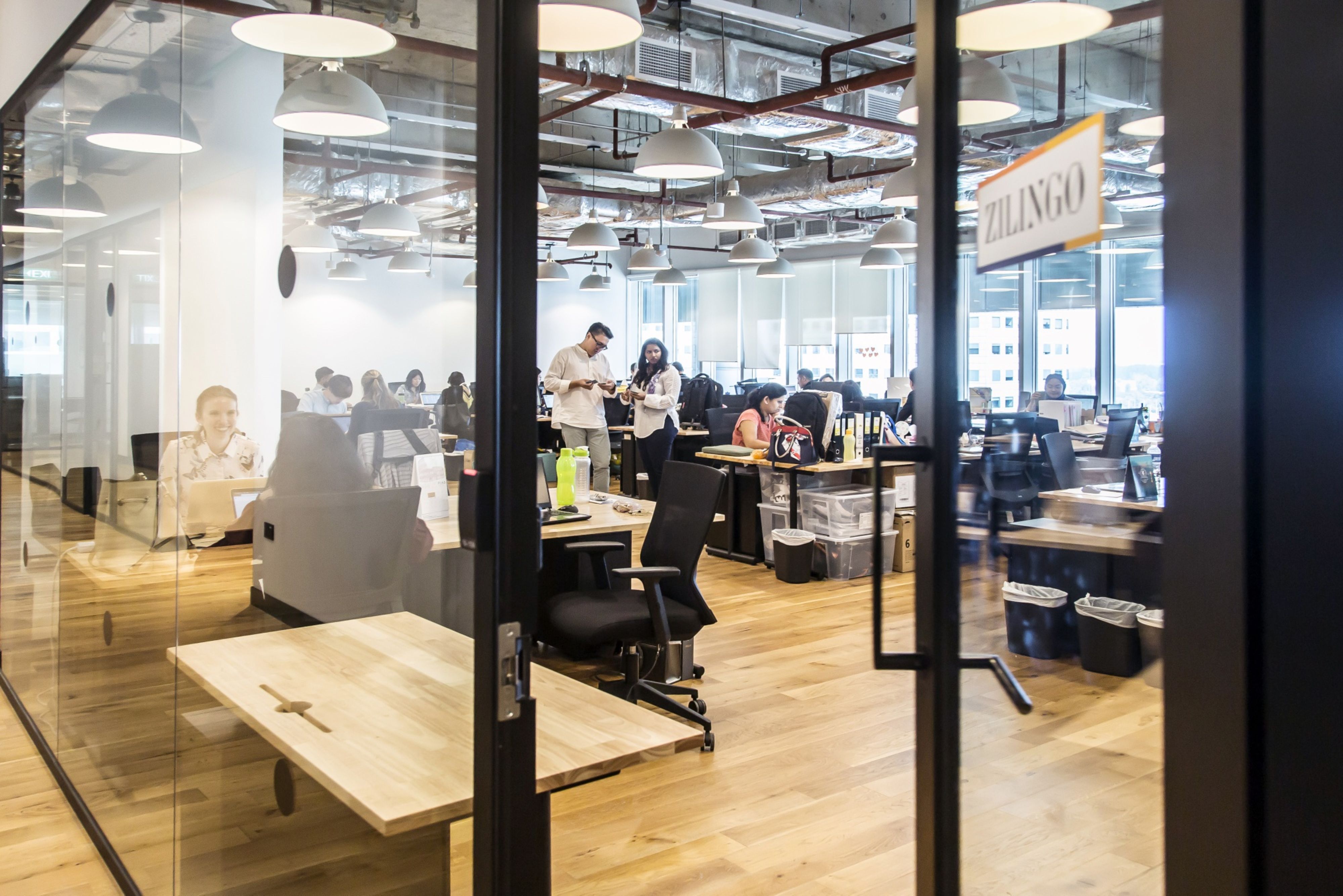 Employees at the Zilingo Pte office in Singapore. Credit: Bloomberg